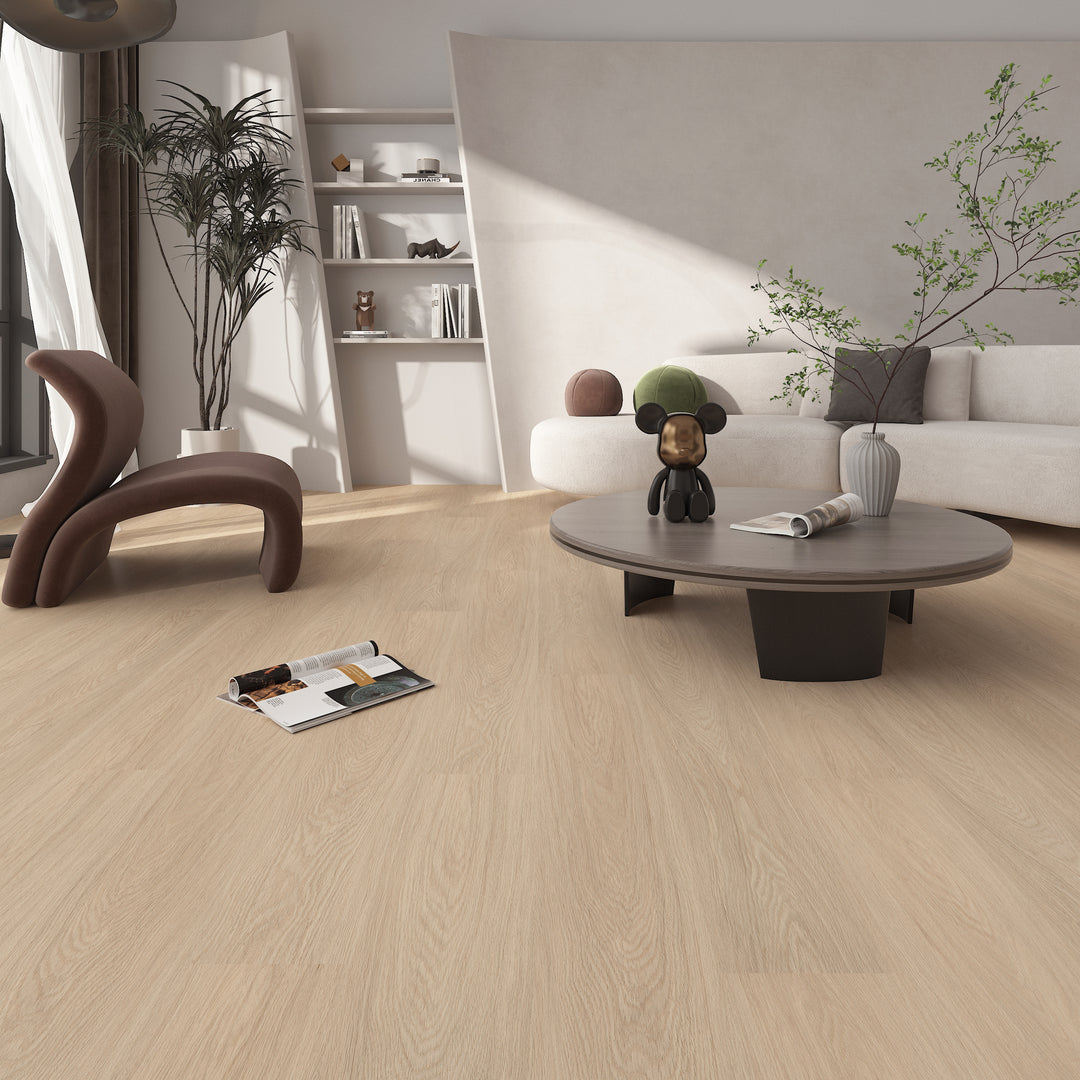 Modern living room with wooden flooring, white sofa, and decorative items.