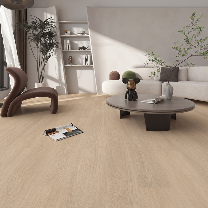 Modern living room with wooden flooring, white sofa, and decorative items.