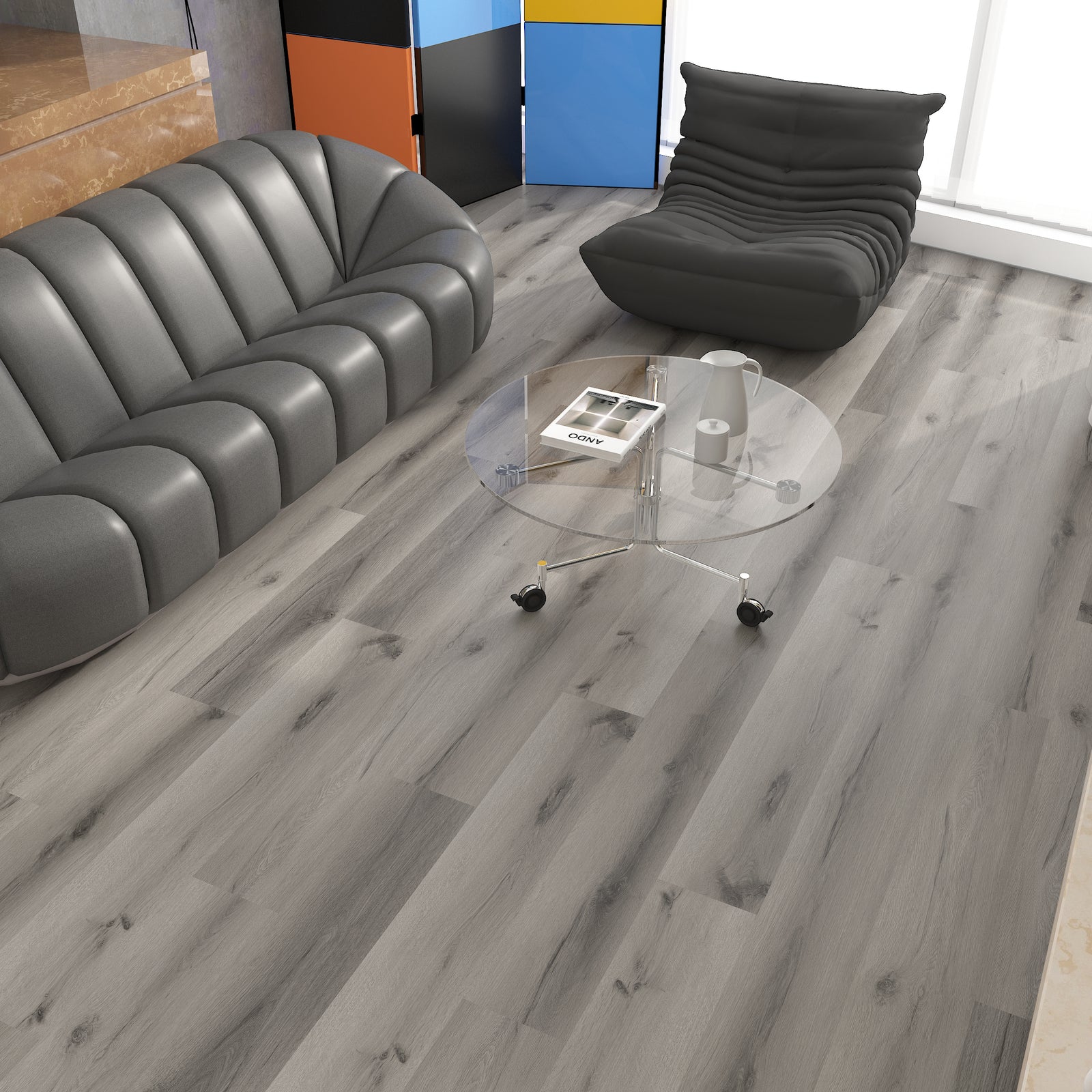 Modern living room with gray sofa, glass coffee table, and colorful wall panels.