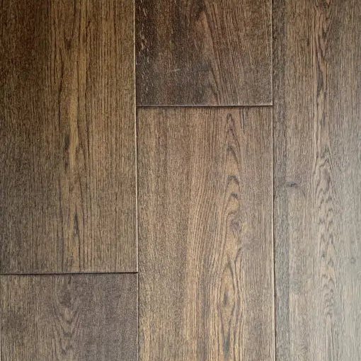 Close-up of wooden flooring with a brown and gray color scheme.