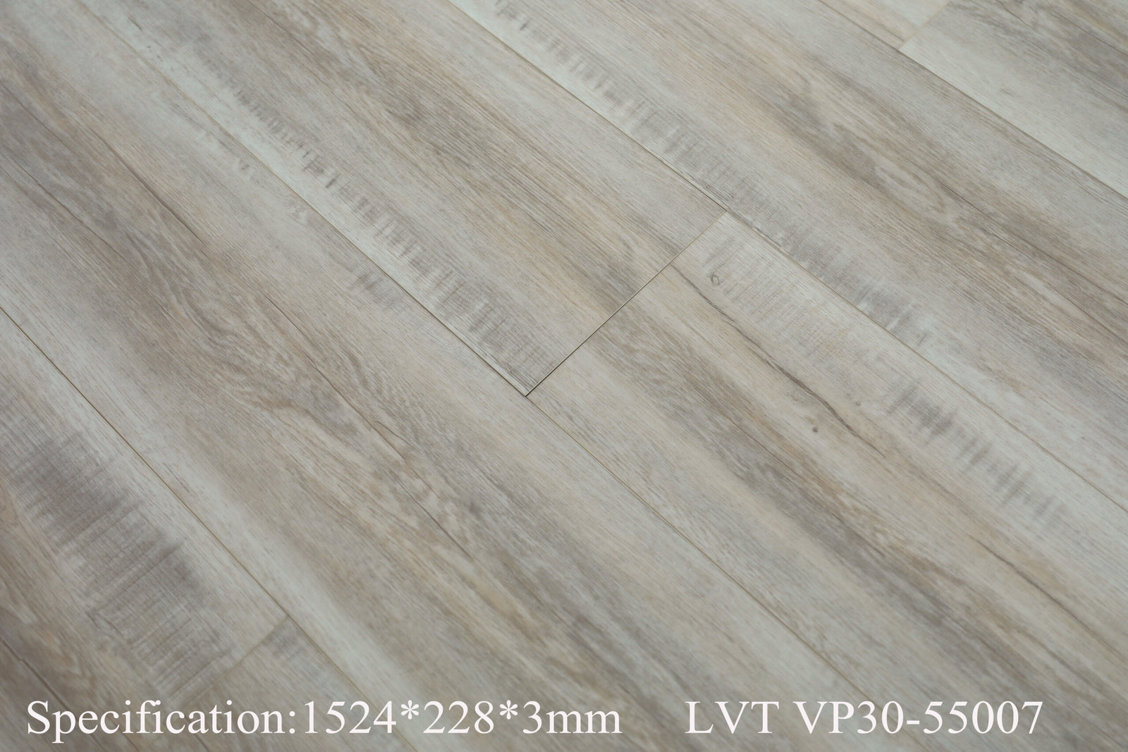 Light gray wood-look laminate flooring planks with a natural grain texture, featuring specification text at the bottom.