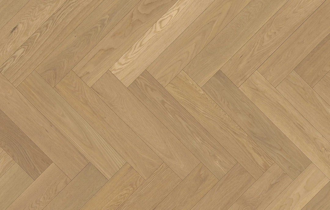 Close-up of Whispering Moor engineered hardwood from Fuzion's Velvet Grove Herringbone collection. Available at Advanced Flooring Waterloo.