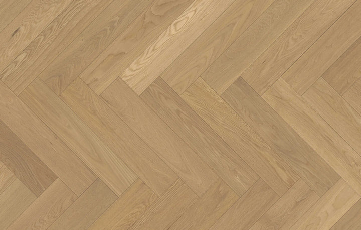 Close-up of Whispering Moor engineered hardwood from Fuzion's Velvet Grove Herringbone collection. Available at Advanced Flooring Waterloo.
