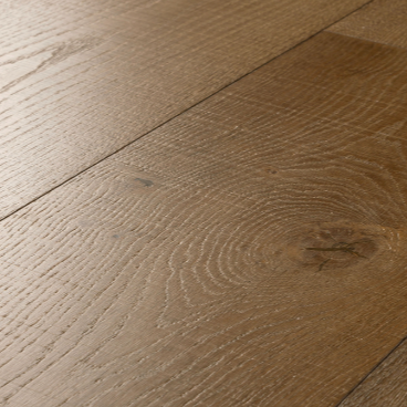 Close-up of wooden flooring with a focus on texture and grain.
