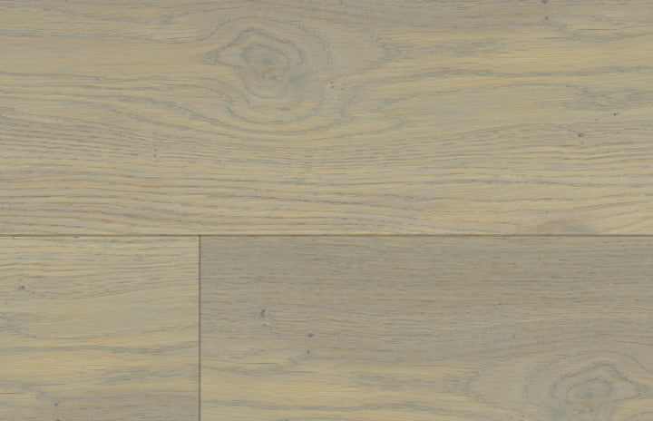 Close-up of Arabelle 7" x 9/16" engineered European oak hardwood flooring from Castello collection, 2.5mm veneer layer, and Light wire-brushed texture. Available at Advanced Flooring Waterloo. 