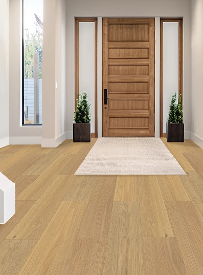Aristo Ash engineered oak hardwood flooring installed in a modern room, featuring wide 7-1/2 inch planks, 2mm veneer layer, and natural wire-brushed finish. 