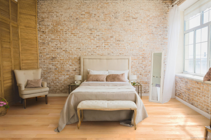 Barista engineered oak hardwood flooring installed in a modern room, featuring wide 5" x 3/4" planks, 3mm - 4mm veneer layer, and natural wire-brushed finish. 
