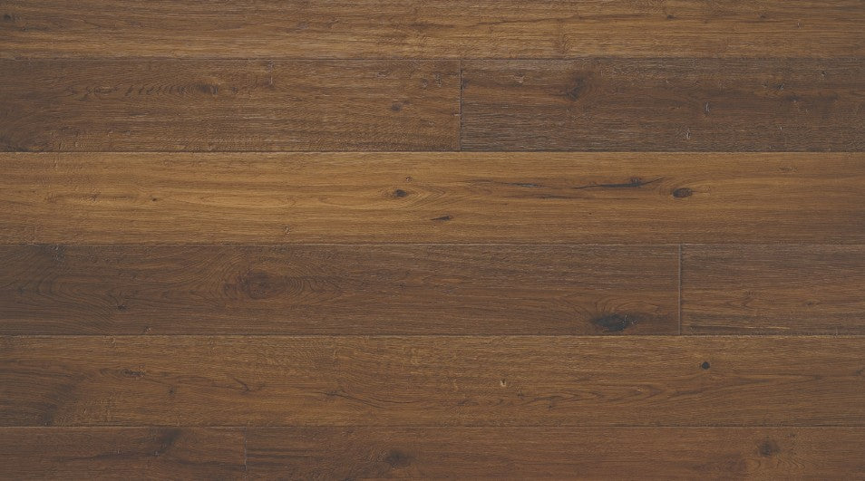 Bronze Dust 7-1/2 inch wide white oak engineered hardwood flooring in dark brown color with distressed hand-scraped texture