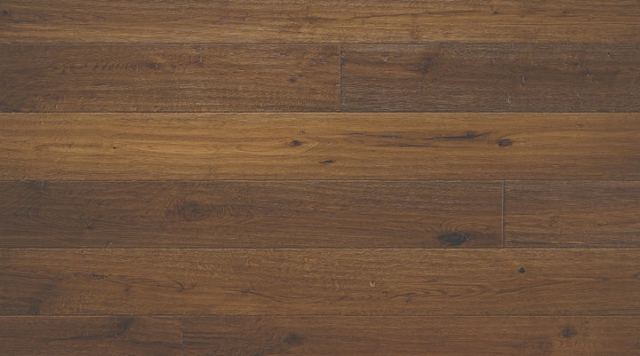Bronze Dust 7-1/2 inch wide white oak engineered hardwood flooring in dark brown color with distressed hand-scraped texture