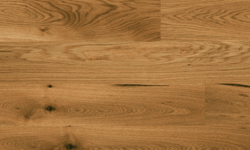 Close-up of Canyon 6" x 9/16" engineered European oak hardwood flooring from Outer Banks Clic collection, 2.5mm veneer layer, and Light wire-brushed texture. Available at Advanced Flooring Waterloo.