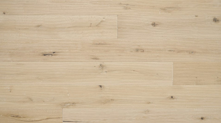 Carrara 7-1/2 inch wide white oak engineered hardwood flooring in natural blonde color with distressed hand-scraped texture