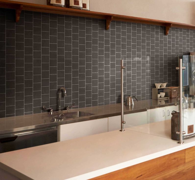 Ceratec Confetto 2x6 matte black porcelain tile flooring and backsplash – sleek and durable porcelain tiles for kitchen walls and modern interiors, from Advanced Flooring Waterloo with nationwide shipping in Canada.