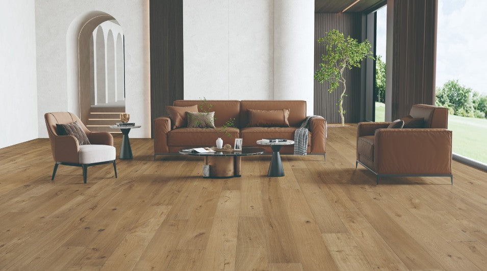 Modern interior featuring Clayborn white oak engineered hardwood flooring with wide 7-1/2 inch planks in natural brown finish from the Atelier Collection