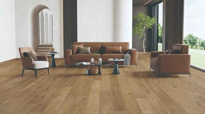 Modern interior featuring Clayborn white oak engineered hardwood flooring with wide 7-1/2 inch planks in natural brown finish from the Atelier Collection