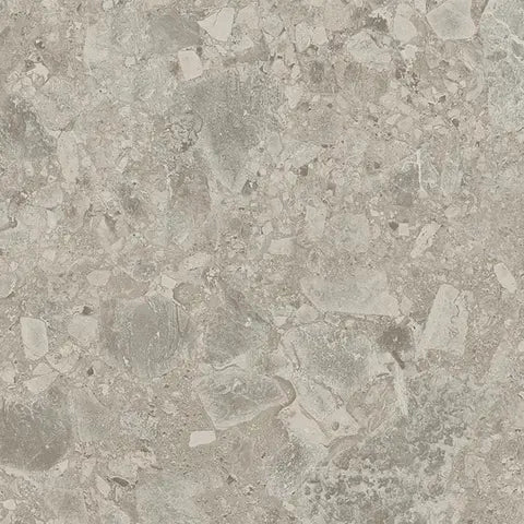 Close-up of a textured stone or concrete surface with a speckled pattern.