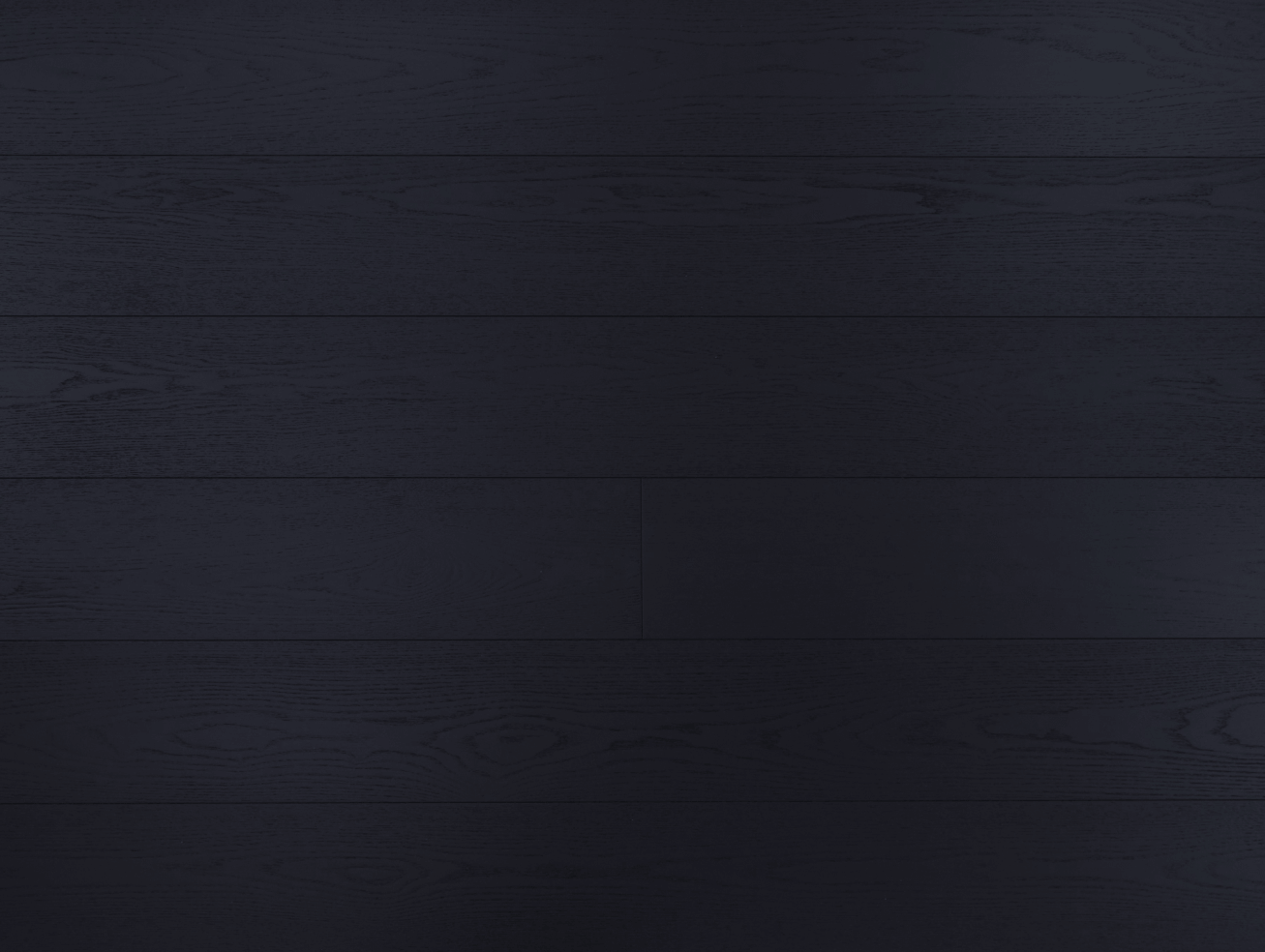 A close up of Ebony VIDAR premium white ash engineered hardwood flooring.