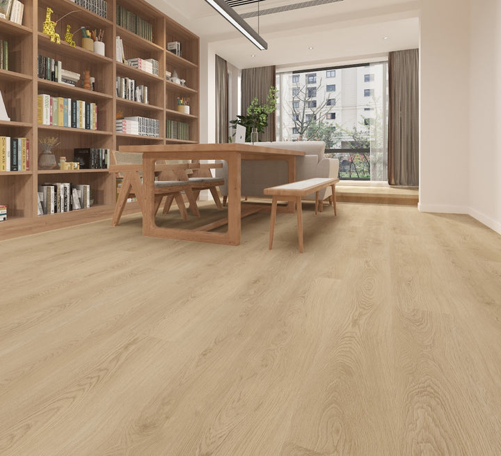 Light oak wood flooring shown in a modern, sunlit home interior with a wooden dining table, bench, bookshelves, and large windows.