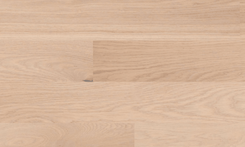 Close-up of Foggy Oasis 6" x 9/16" engineered European oak hardwood flooring from Outer Banks Clic collection, 2.5mm veneer layer, and Light wire-brushed texture. Available at Advanced Flooring Waterloo.
