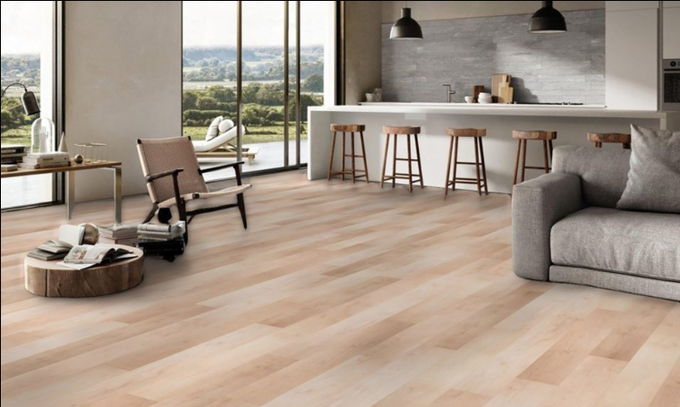 Fontana Fuzion FuzGuard waterproof laminate flooring installed in modern living space, durable AC4 12mm planks. Available at Advanced Flooring Waterloo.