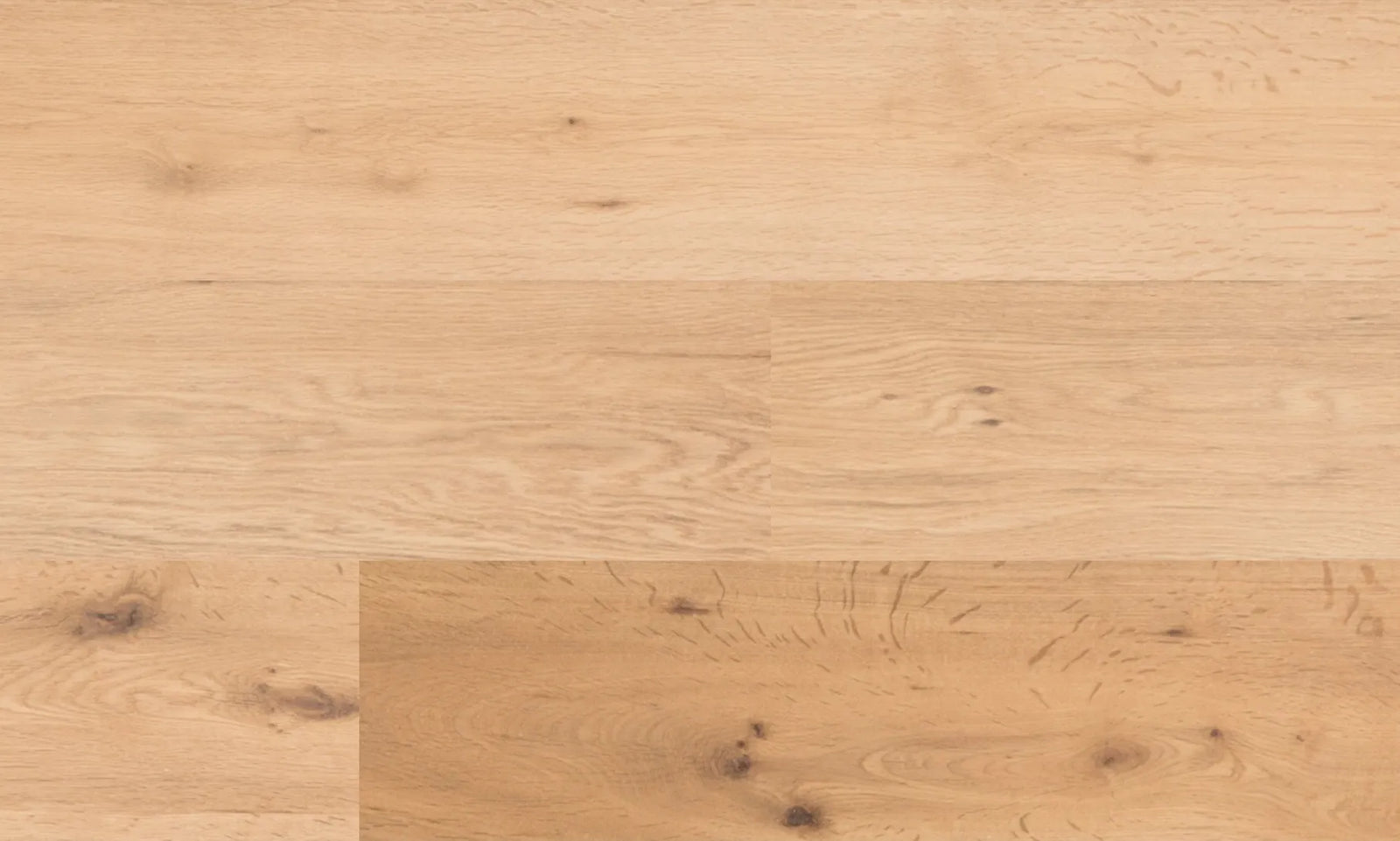 Close-up of Rubato oak engineered hardwood flooring showing wirebrushed matte texture and natural grain pattern for timeless interior design. Available at Advanced Flooring Waterloo.