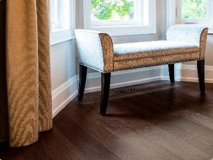 Hatteras engineered oak hardwood flooring from Outer Banks Elite collection installed in a modern room, featuring wide 6" x 3/4" planks, 3mm veneer layer. Canada-wide delivery available. 
