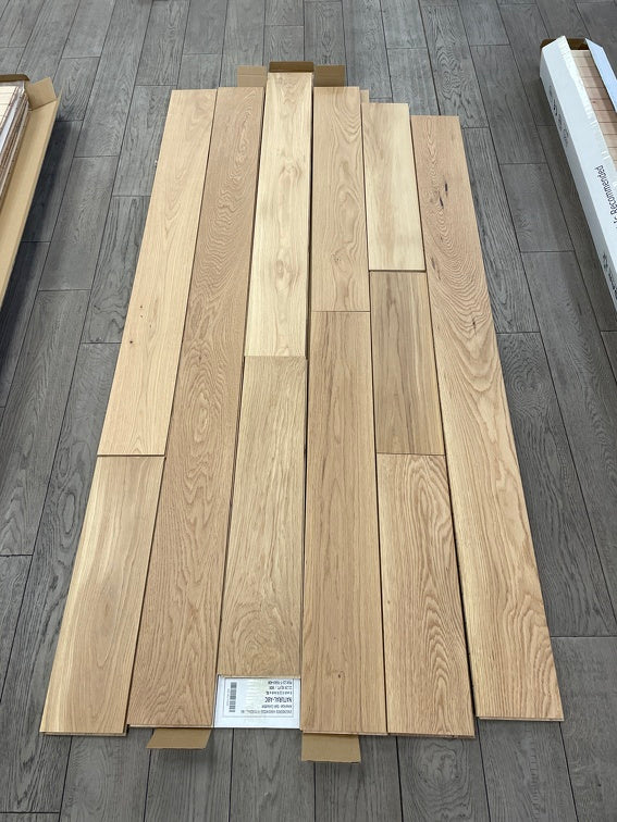 Planks of Honey Wheat VIDAR premium American Hickory engineered hardwood flooring.