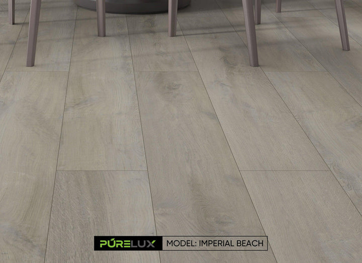 A bright and inviting kitchen showcasing the rich, gray brown tones of Purelux wide vinyl plank flooring.