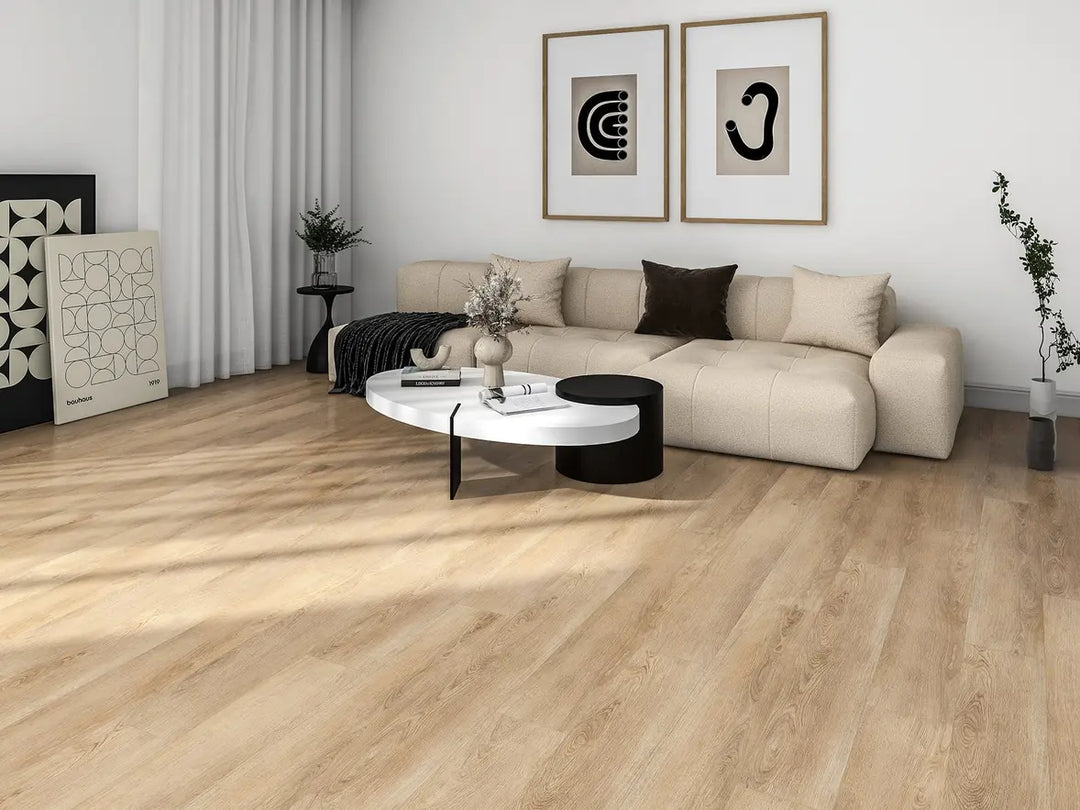 Modern living room with a beige sectional sofa, round coffee table, and decorative items.