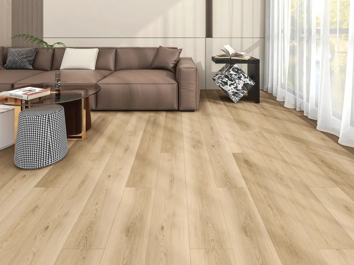 Living room with wooden flooring, brown sectional sofa, and decorative items.