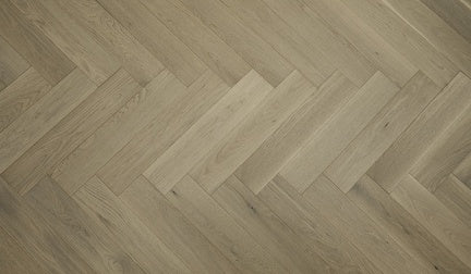 A close up of Moonlight VIDAR premium 5” American white oak engineered hardwood flooring in herringbone.