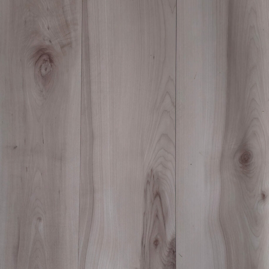 Close-up of vinyl flooring with visible grain and texture. 