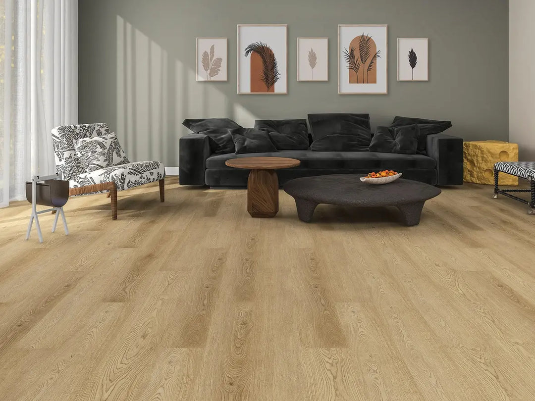 Modern living room with a black sectional sofa, coffee table, and decorative wall art.