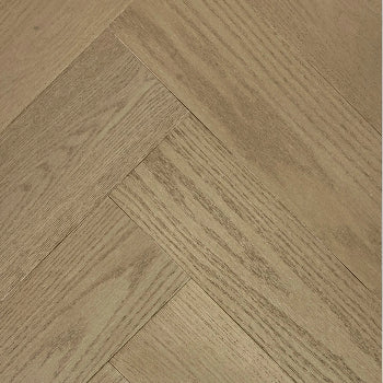 A close up of Nature LUCID premium engineered hardwood herringbone flooring from Canadian Standard.