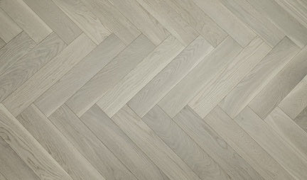 A close up of Pearl VIDAR premium 5” American white oak engineered hardwood flooring in herringbone.