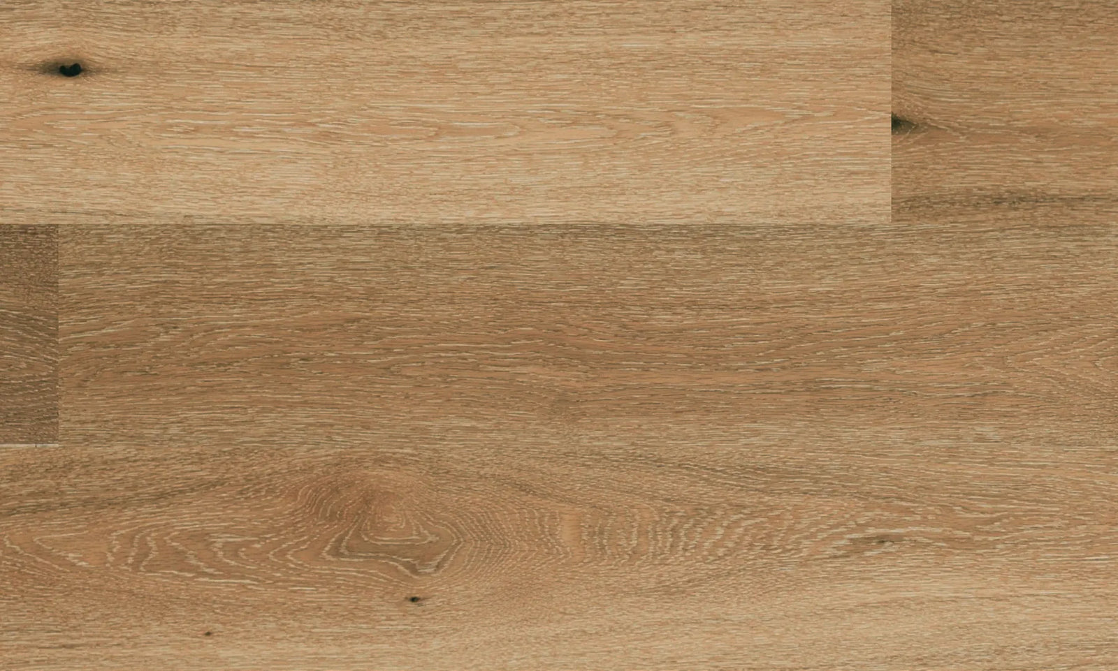 Close-up of Prelude engineered oak hardwood flooring by Fuzion, featuring a wire-brushed texture, 7 1/2" x 9/16" plank. Available at Advanced Flooring Waterloo.