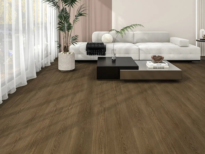 Modern living room with wooden flooring, white sofa, and decorative elements.