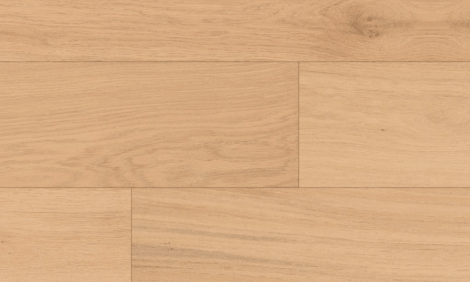 Close-up of Seaglass engineered oak hardwood flooring by Fuzion’s Coastline Collection, featuring a wire-brushed texture, 7 1/2" x 1/2" plank. Available at Advanced Flooring Waterloo.