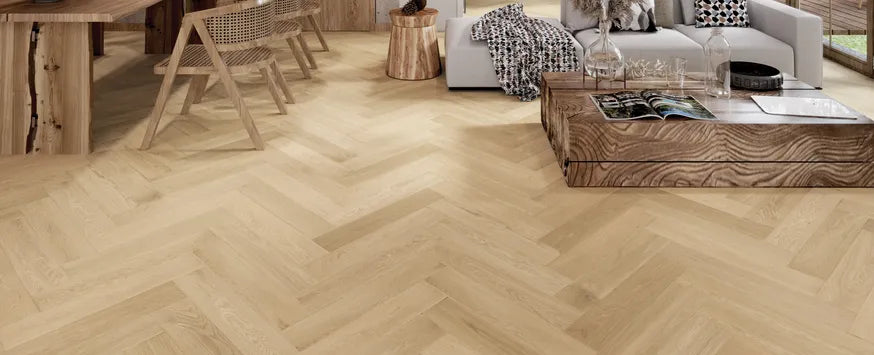 Room view of Serene Haze engineered hardwood from Fuzion's Velvet Grove Herringbone collection. Available at Advanced Flooring Waterloo.