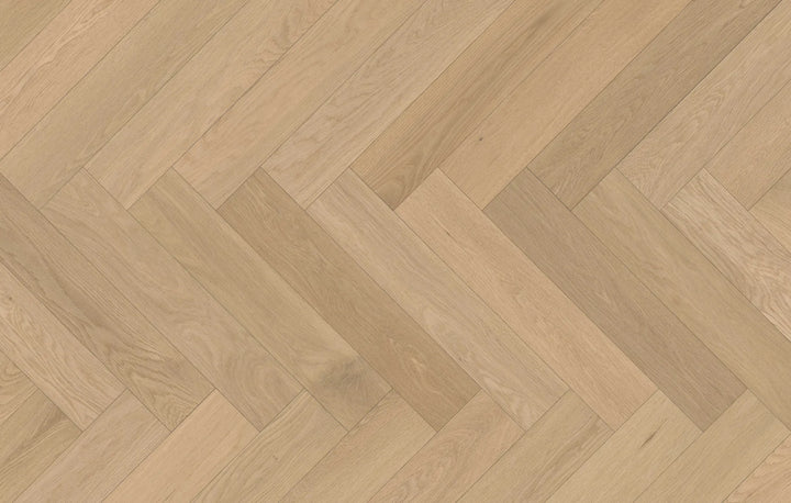 Close-up of Serene Haze engineered hardwood from Fuzion's Velvet Grove Herringbone collection. Available at Advanced Flooring Waterloo.