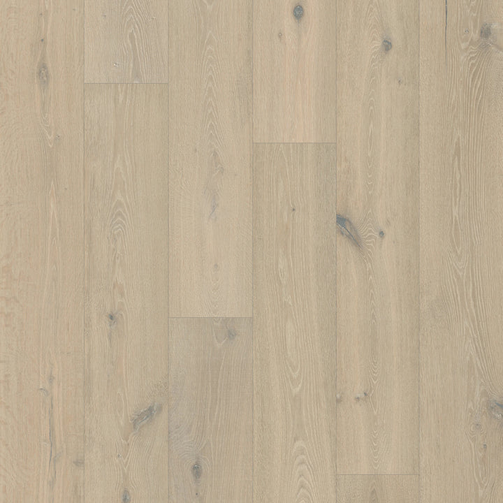 Close-up of a Snowfall Glow by Fuzion TruNorth is engineered hardwood flooring featuring wide planks and a durable 3mm top layer.