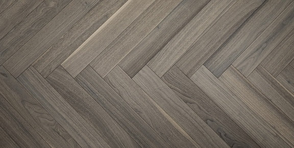 A close up of Provence VIDAR premium 5” engineered hardwood flooring in herringbone.