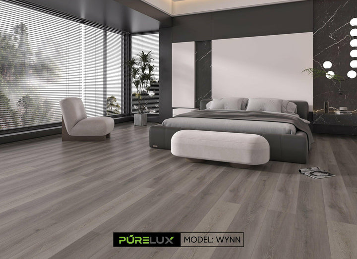 Wide view of Purelux Wynn Journey Series 9mm SPC vinyl plank flooring in elegant modern bedroom – grey luxury vinyl tiles