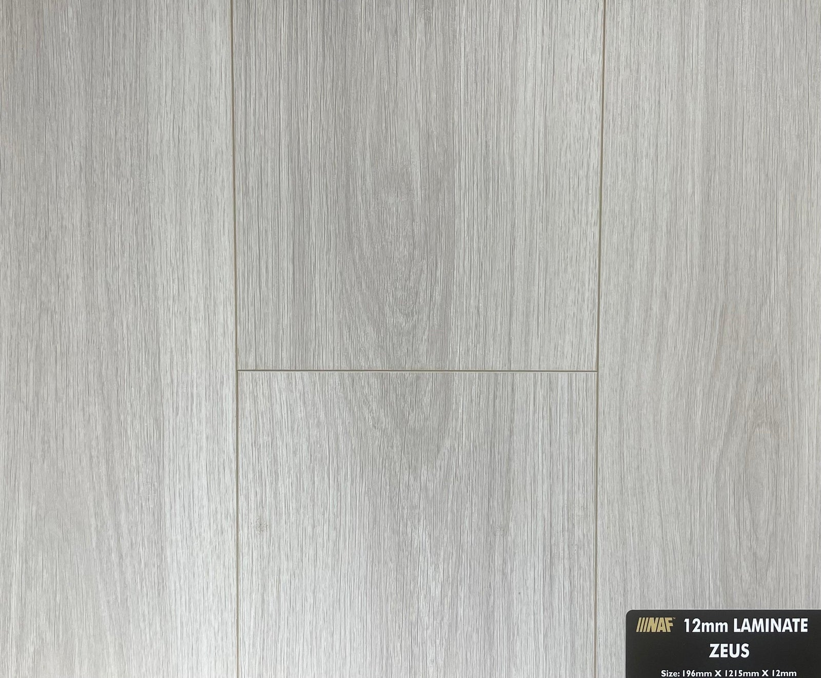 Close-up showing the texture and color of Zeus NAF 12mm handscraped laminate flooring.