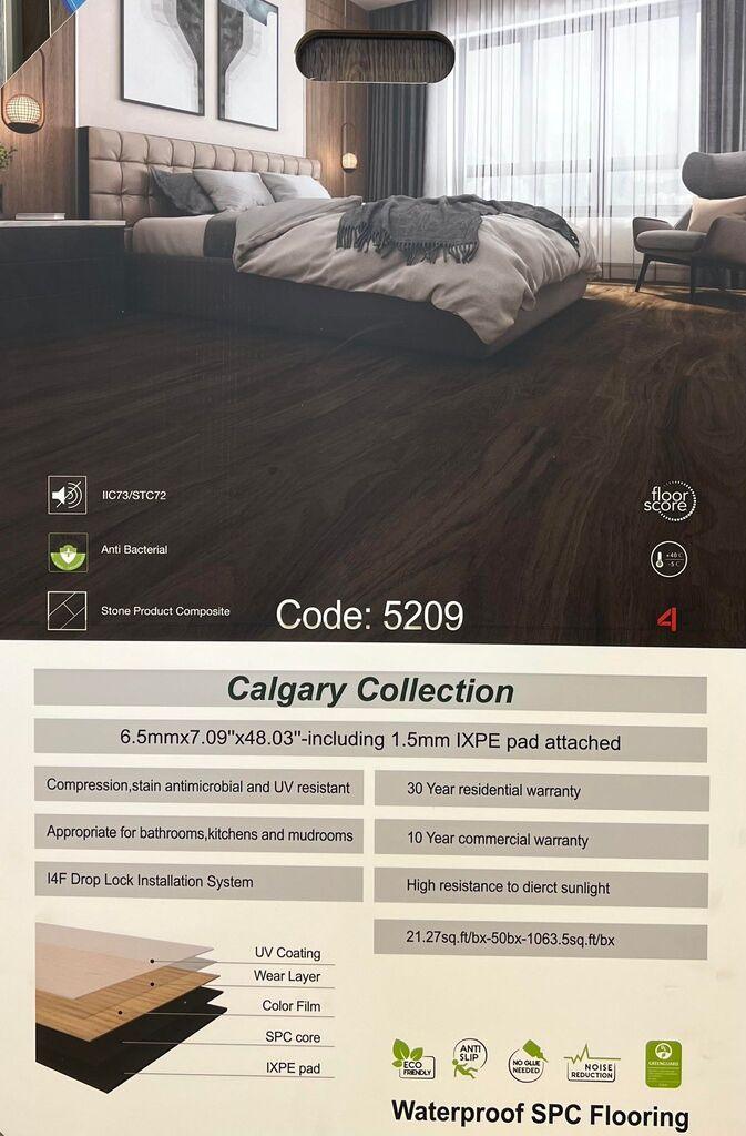 A modern bedroom which displays the beautiful look of Riche vinyl flooring.