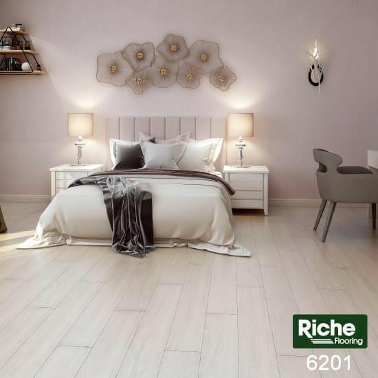 A modern bedroom which displays the beautiful look of Riche 8mm vinyl flooring.
