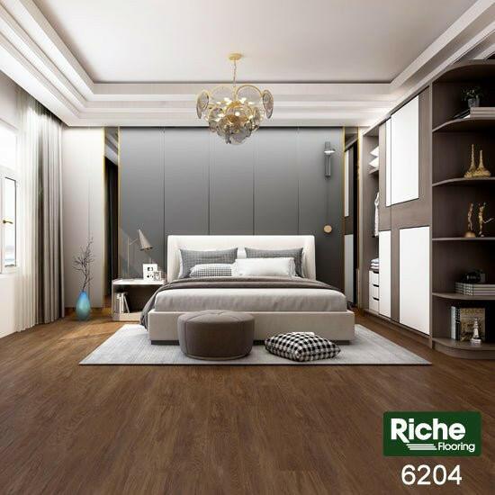 A modern bedroom which displays the beautiful look of Riche 8mm vinyl flooring.