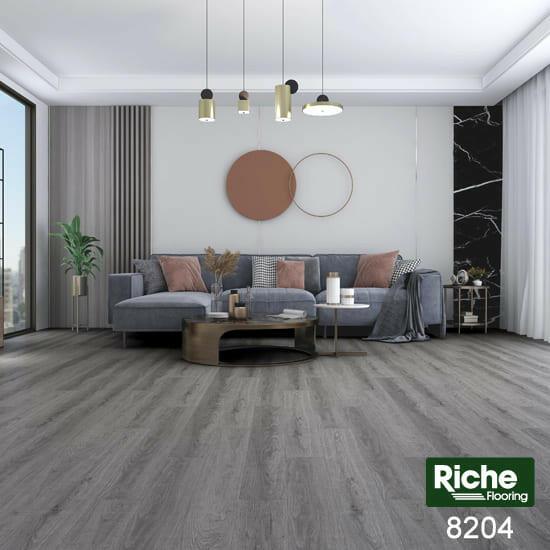 A modern bedroom which displays the beautiful look of Riche vinyl flooring.