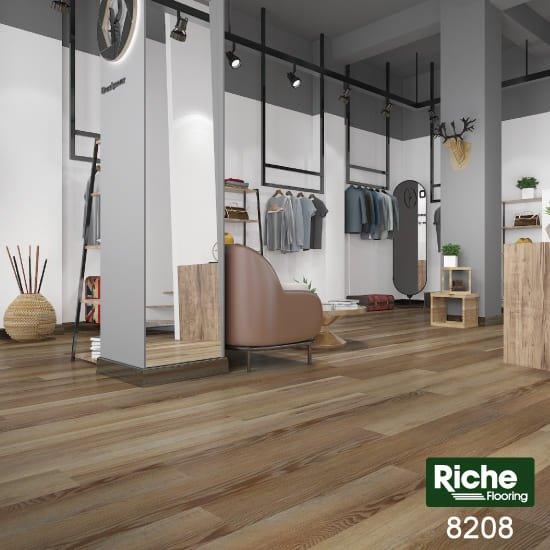 A modern bedroom which displays the beautiful look of Riche vinyl flooring.