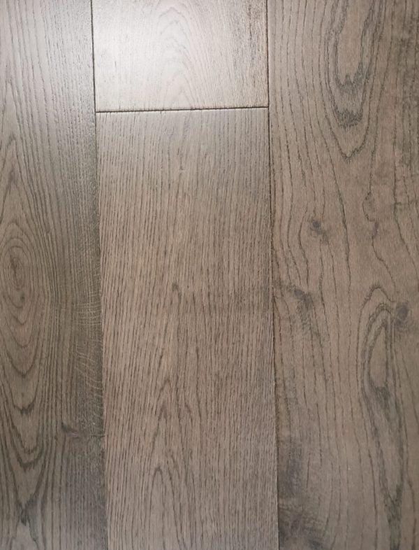 A close-up of Black Pepper European 7.5" Oak Engineered Hardwood from Riche.