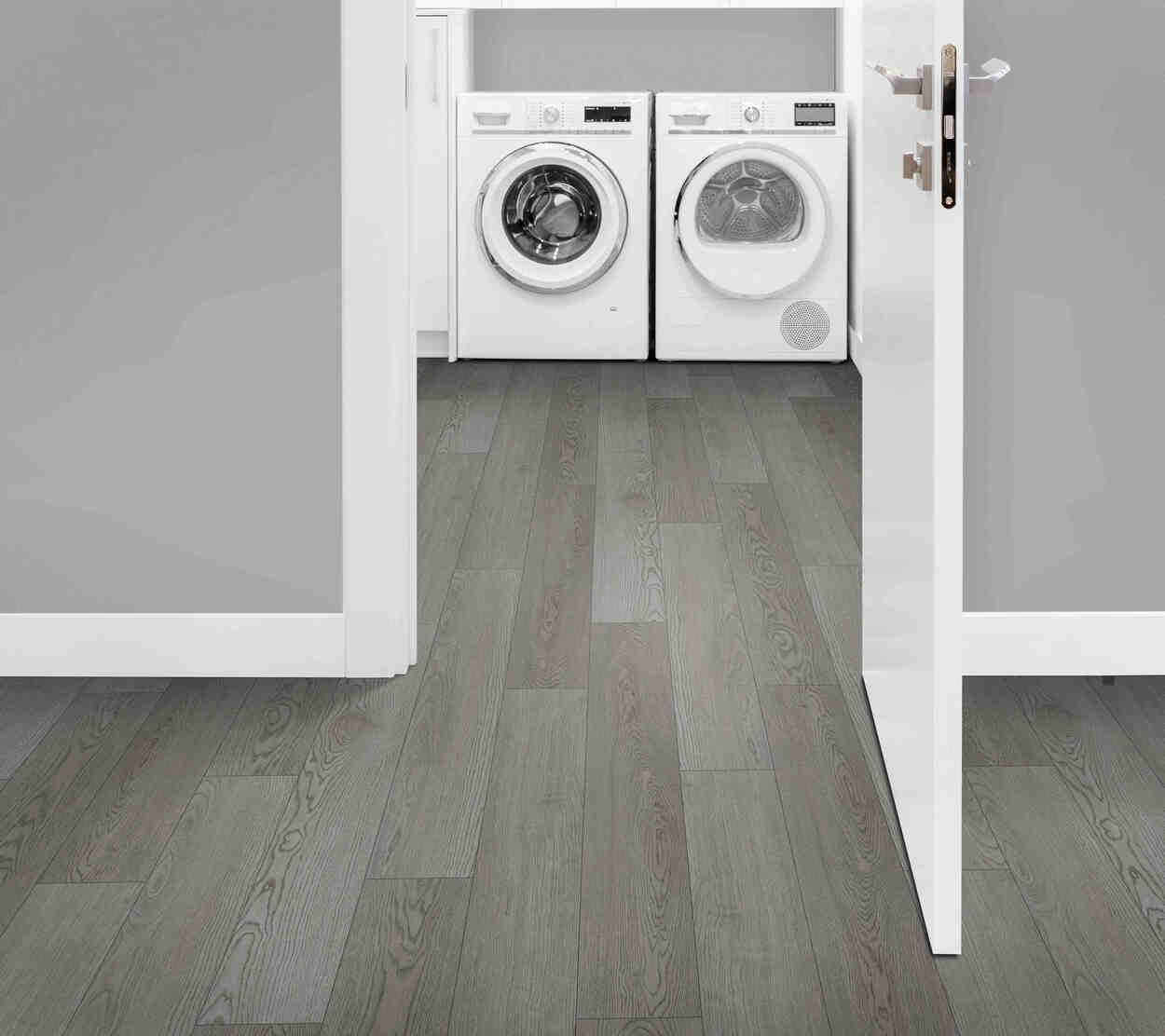 Laundry room with 6mm vinyl plank installed in the colour Bridges by Mohawk SolidTech sold by Advanced Flooring in Kitchener-Waterloo.